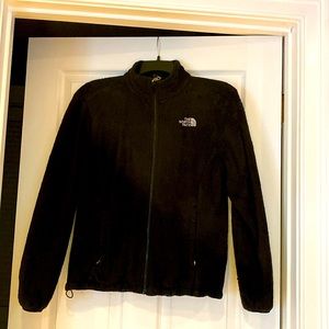 Black medium north face zip up jacket front pockets, zippers pockets